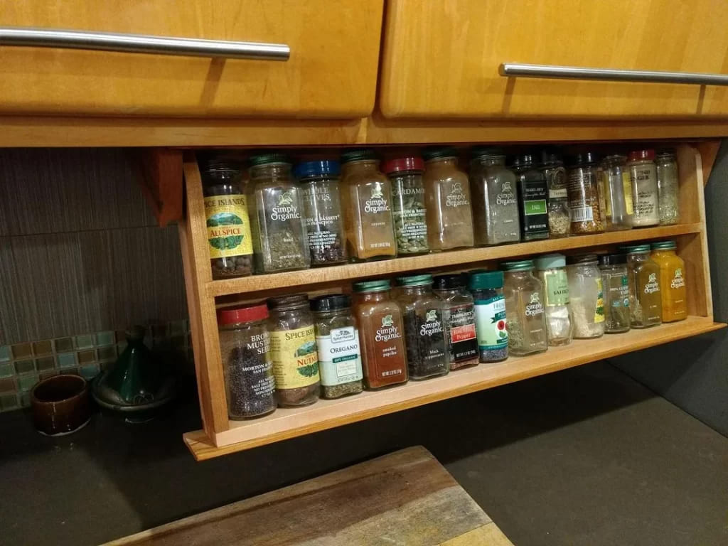 hanging spice jars under cabinet