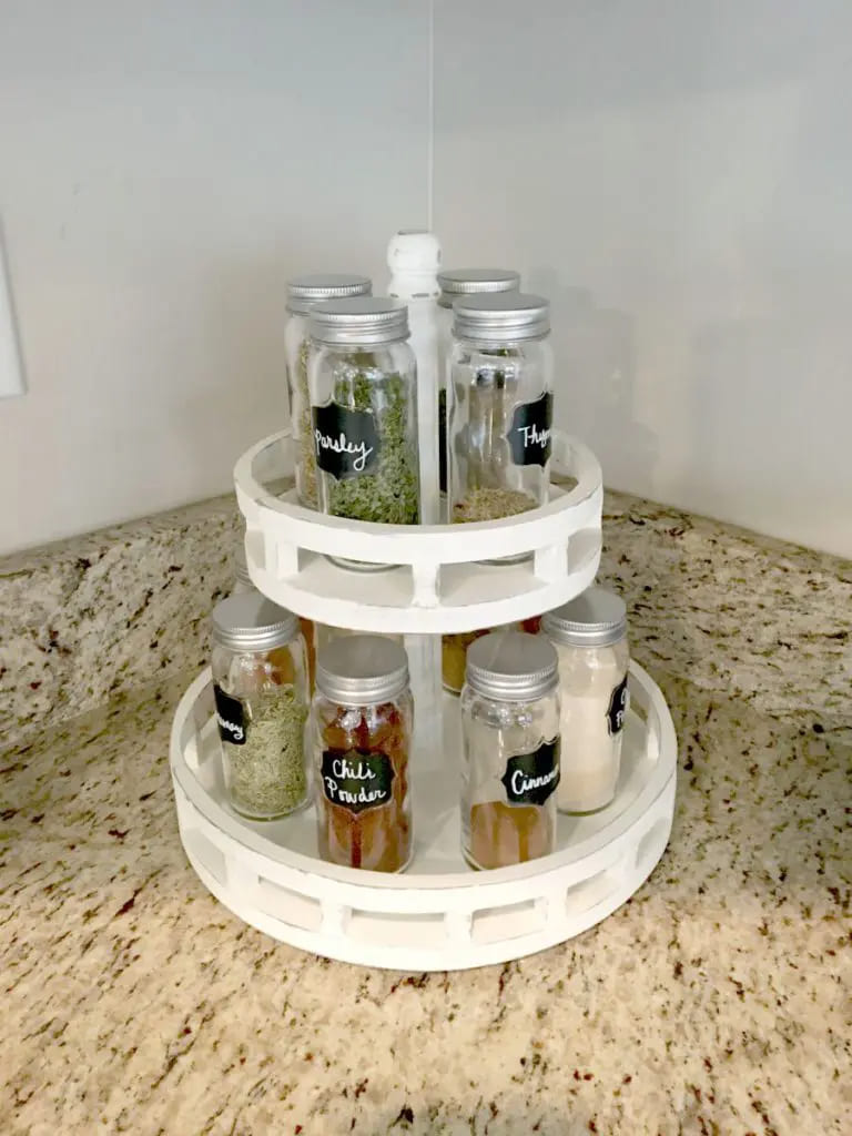 lazy susan used as a spice rack placed on a kitchen counter