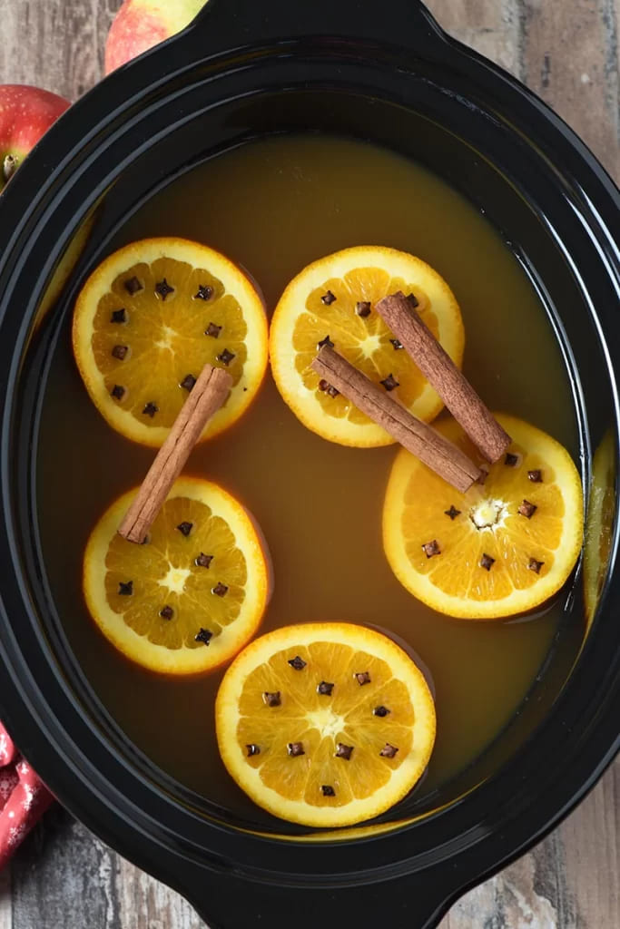 mulled cider in a slow cooking pot