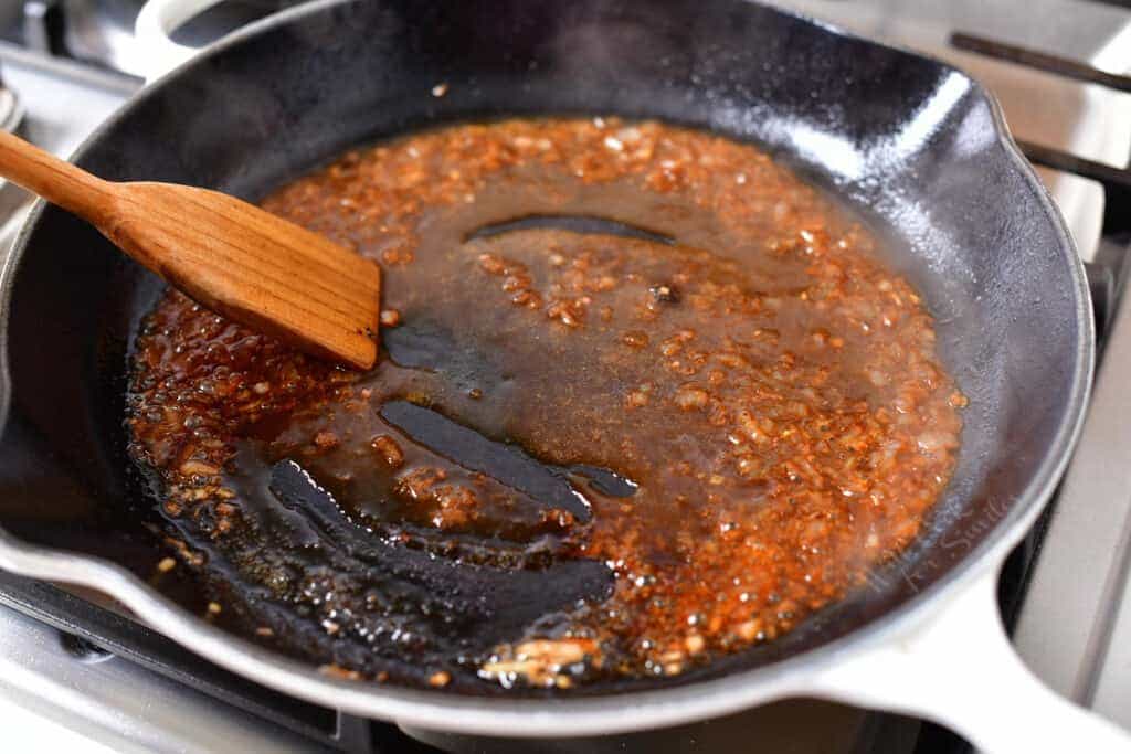 preparation of black pepper sauce in a skillet