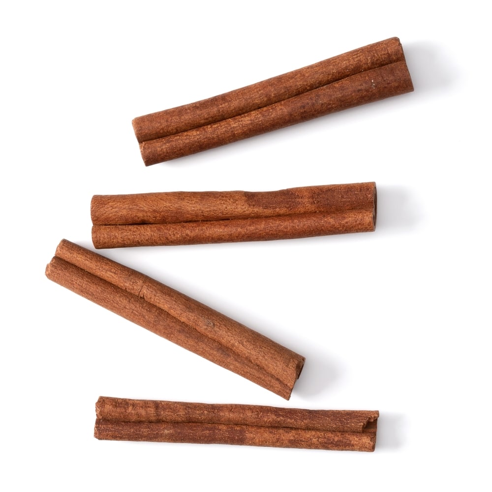 Cinnamon Sticks Isolated Over White Background Closeup 