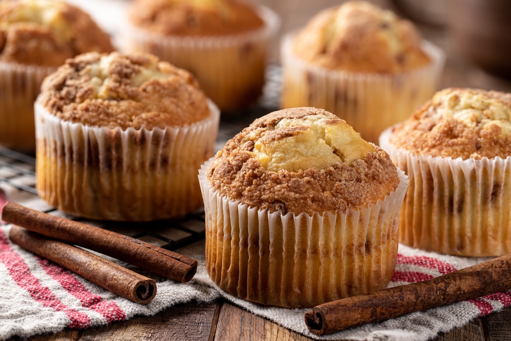 Closeup Of A Bunch Of Cinnamon Muffins And Cinnamon Sticks