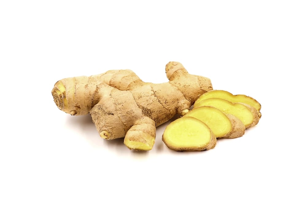 Fresh ginger and sliced ​​ginger isolated on white background.