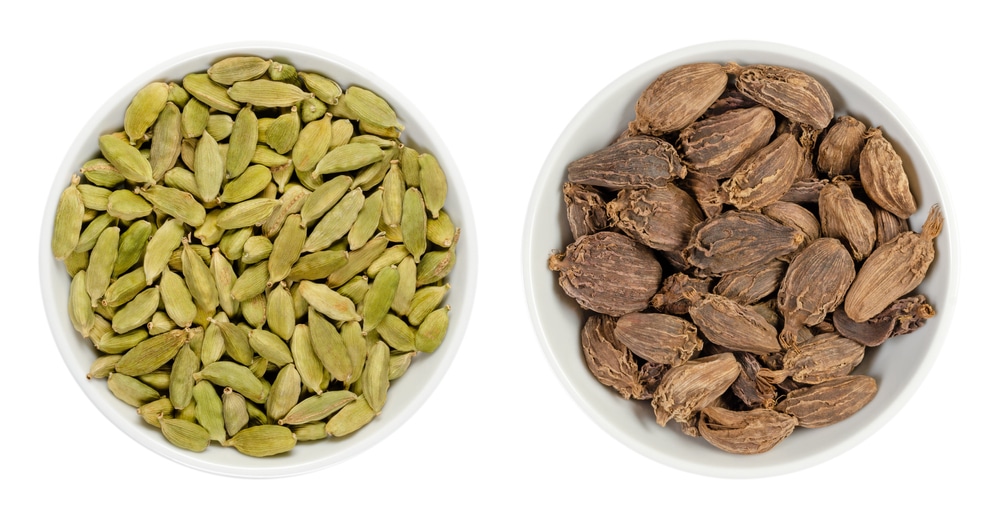 Green And Black Cardamom Pods In White Bowls Processed Fruits