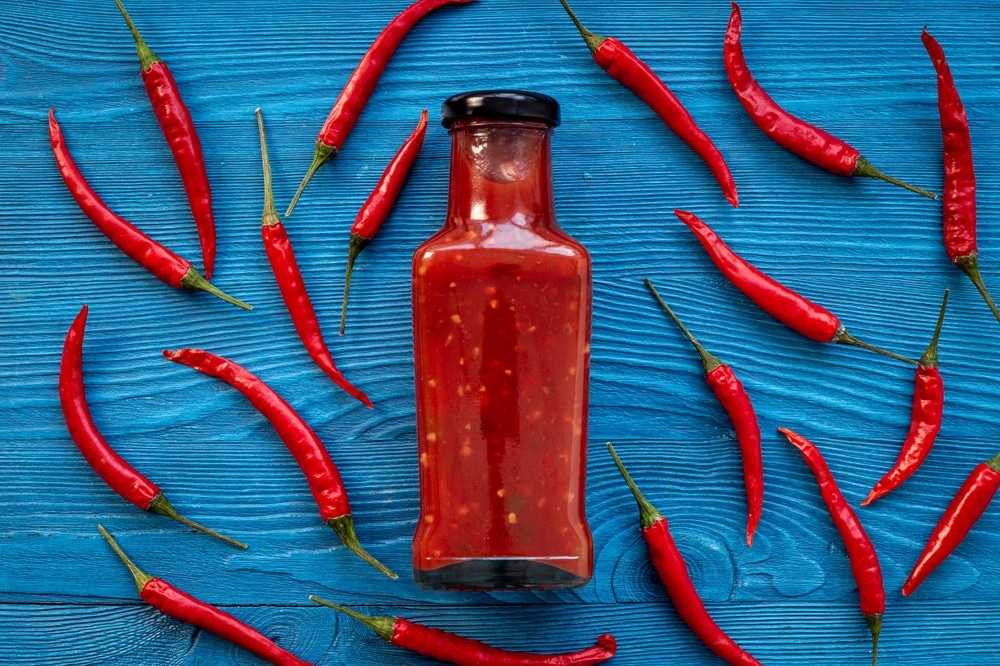 Tabasco Hot Pepper Sauce With Red Chili Pepper Flat Lay