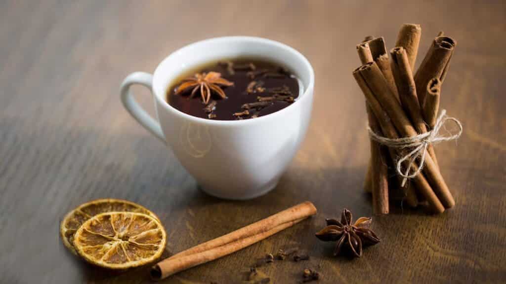 clove tea along with dires lemon slices and some cinammom sticks