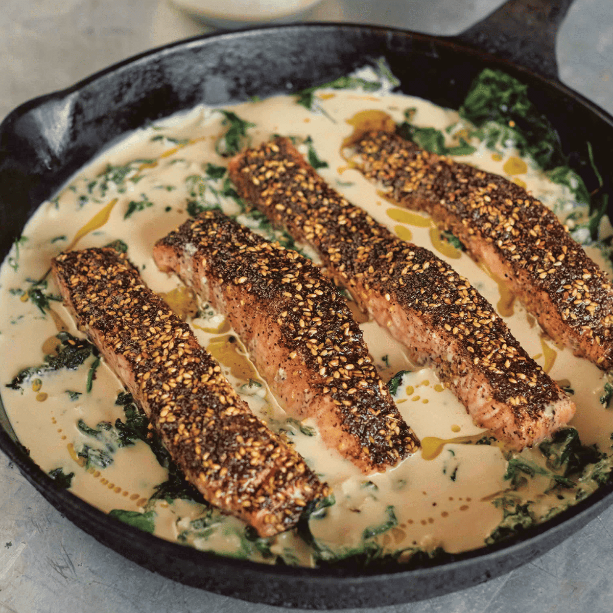 salmon fillets with zaatar in a dish