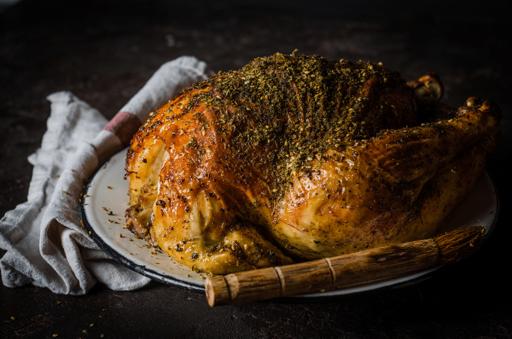 Chicken with zatar (zaatar) on dark background