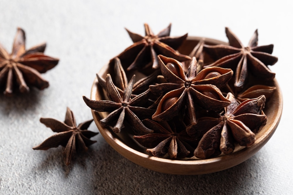 Indian Spice Whole Stars Anise In Wooden Plates On Gray