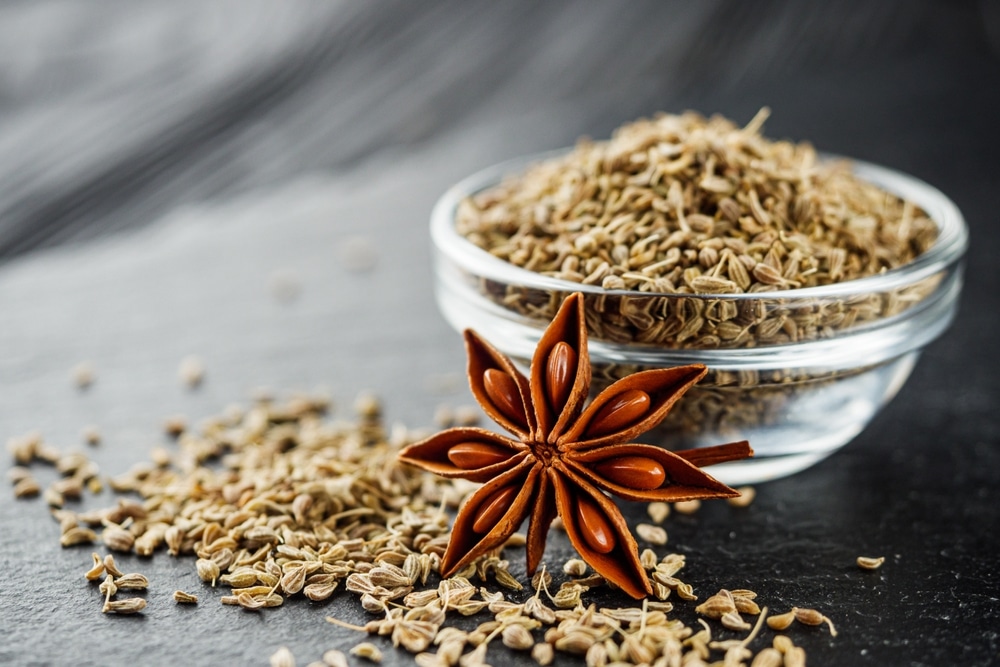 Aromatic Dry Anise Seeds On A Dark Black Stone Background