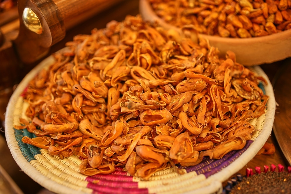 Vibrant Dried Mace In A Traditional Spice Shop Showcasing Its