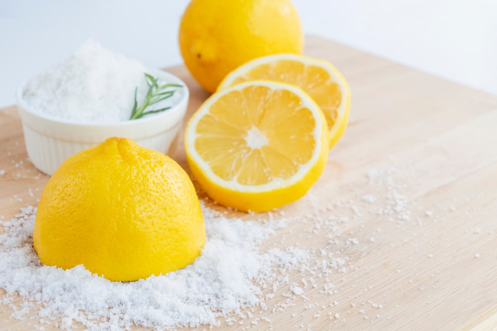 Lemon and salt on a wooden surface