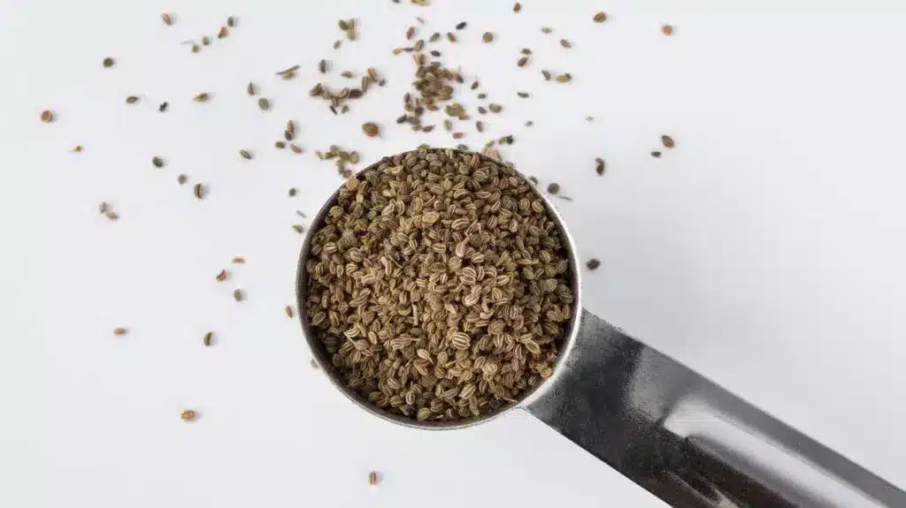 nigella seeds in a wooden spoon