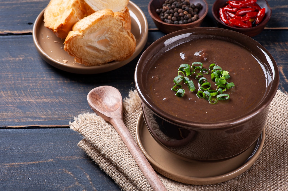 Delicious dish of Brazilian cuisine called Caldo de Feijão. Made with black beans, bacon and sausage. Bean broth.