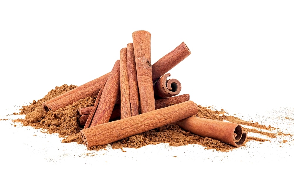 Cinnamon Sticks And Ground Cinnamon Isolated On A White Background